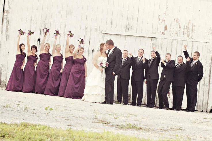 Bride and Groom Kissing and Bridal Party