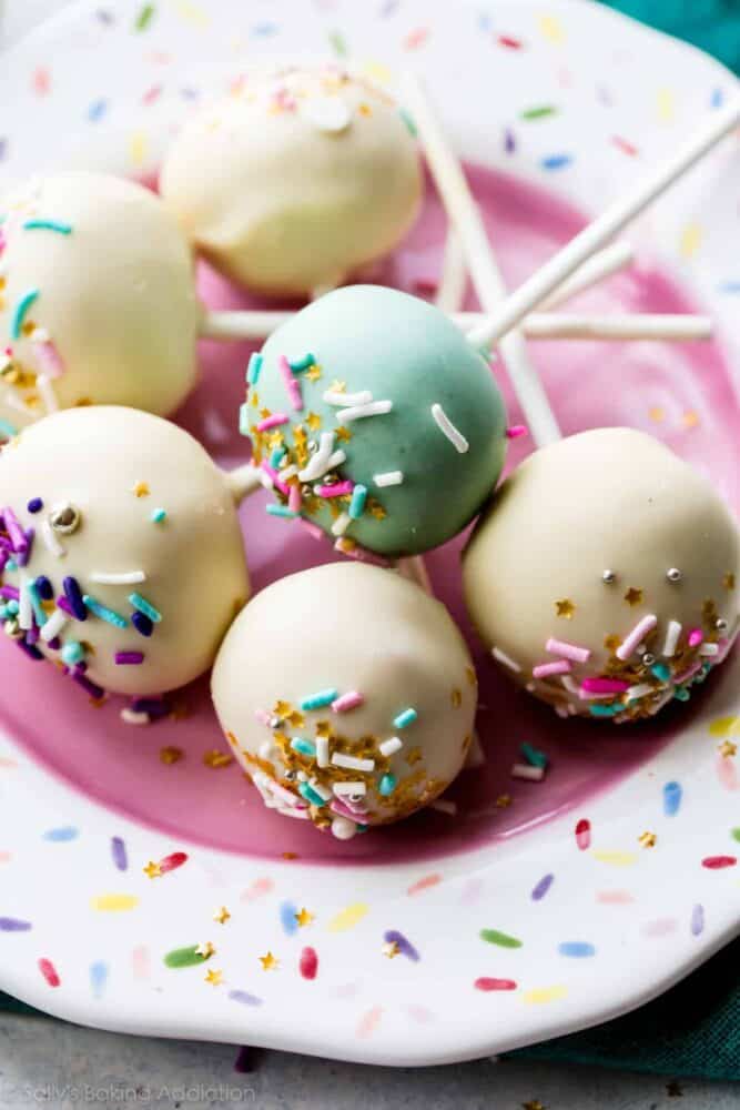 vanilla cake pops on a sprinkle plate