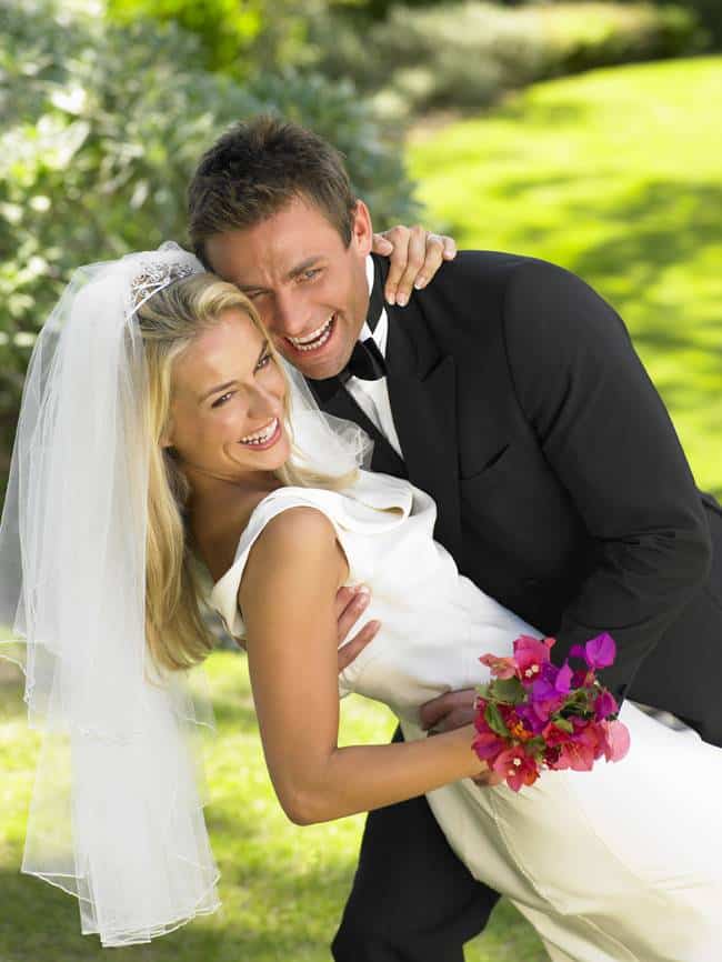 Bride and groom smiling