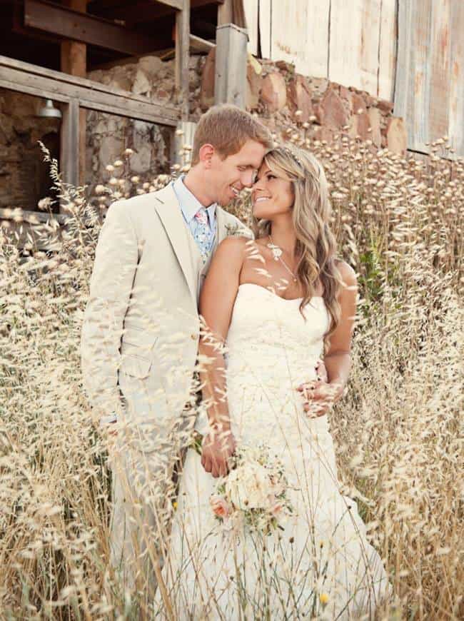 Bride and Groom Standing in Long Grass