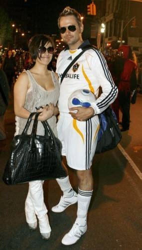 182137-participants-dressed-as-david-and-victoria-beckham-take-part-in-the-an