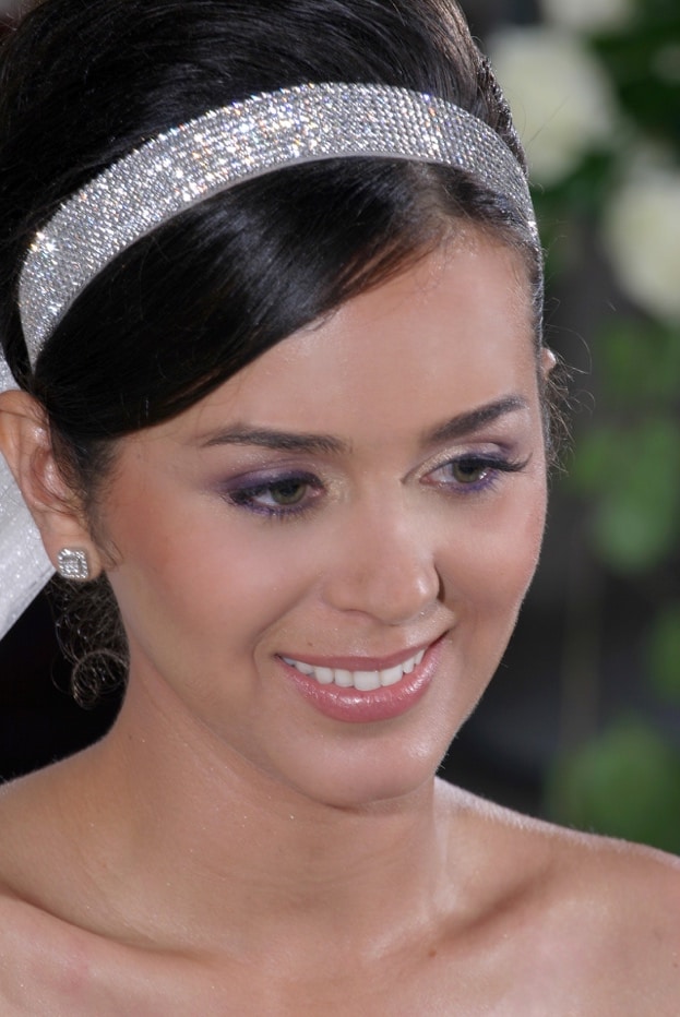 A person smiling for the camera Description automatically generated