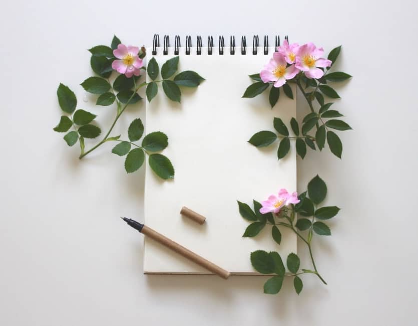A vase of flowers on a table Description automatically generated