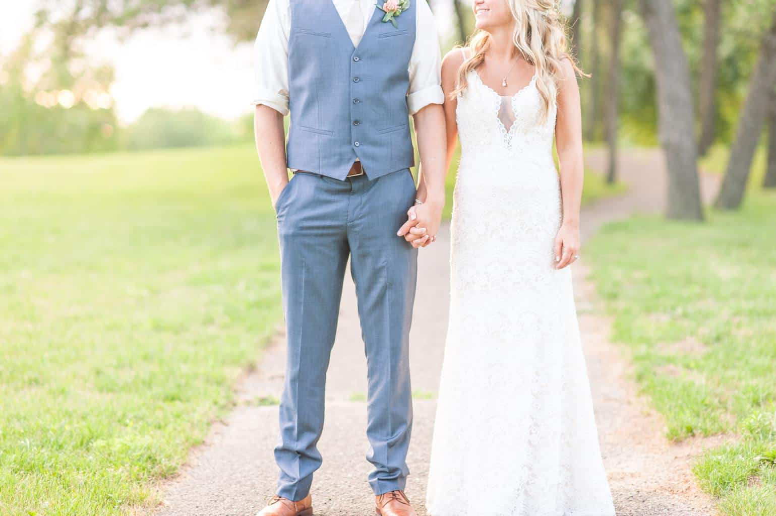 man and woman holding hands during daytime