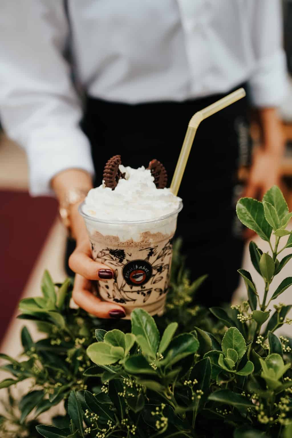 Person Holding White Ice Cream