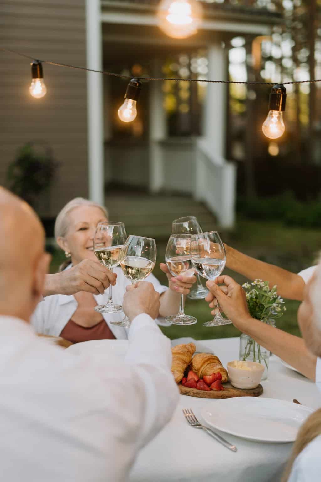 Man in White Thobe Holding Clear Wine Glass