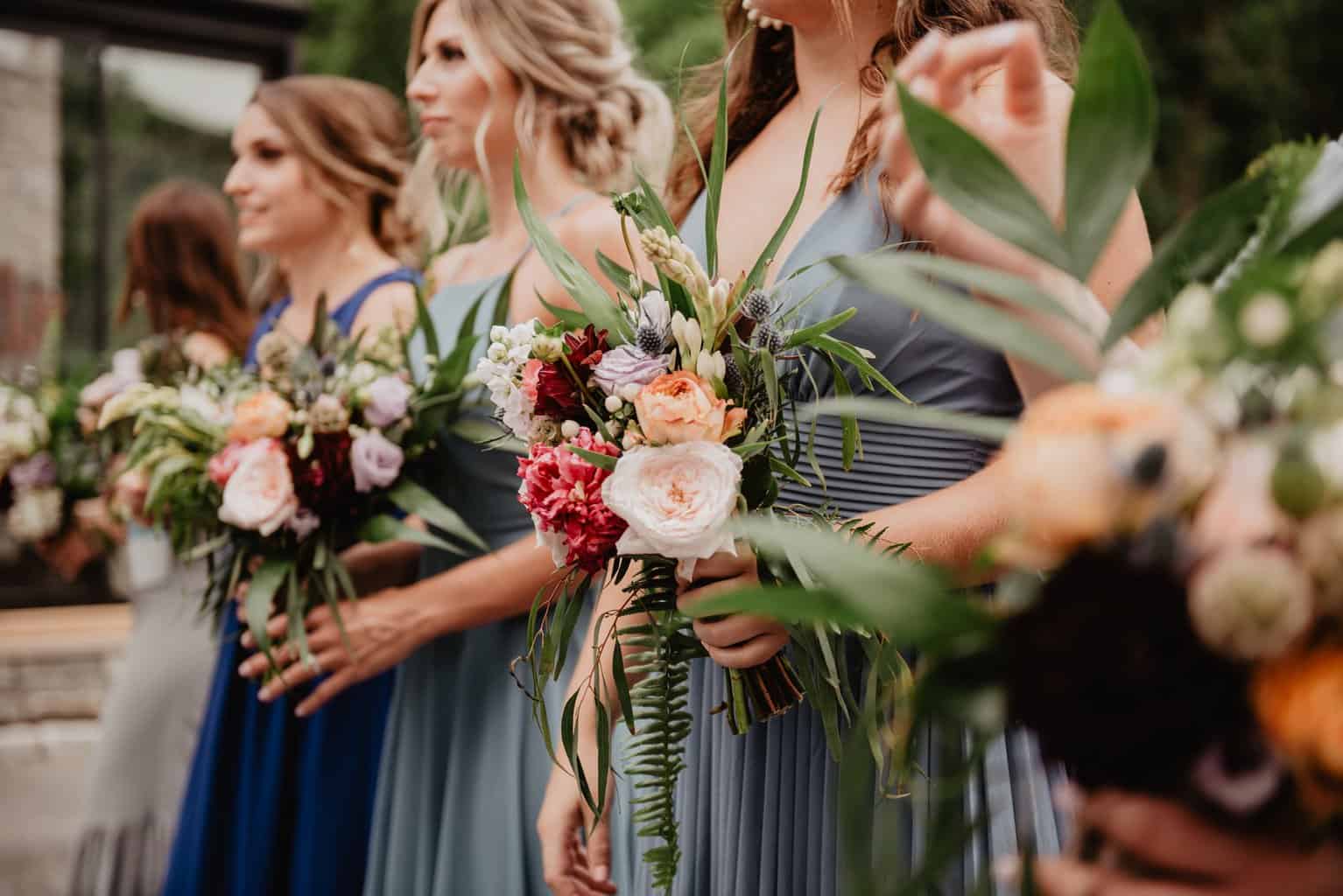Free Selective Focus Photography of Women Holding Wedding Flowers Stock Photo