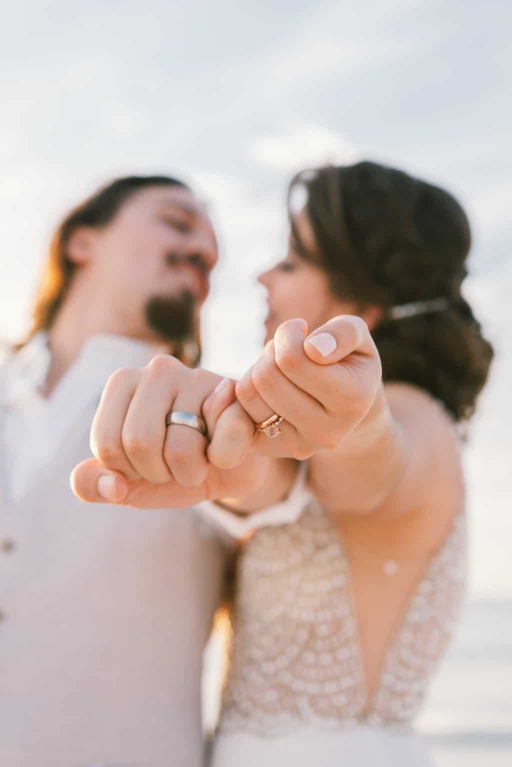 Free Newlywed Couple Showing Their Wedding Rings  Stock Photo