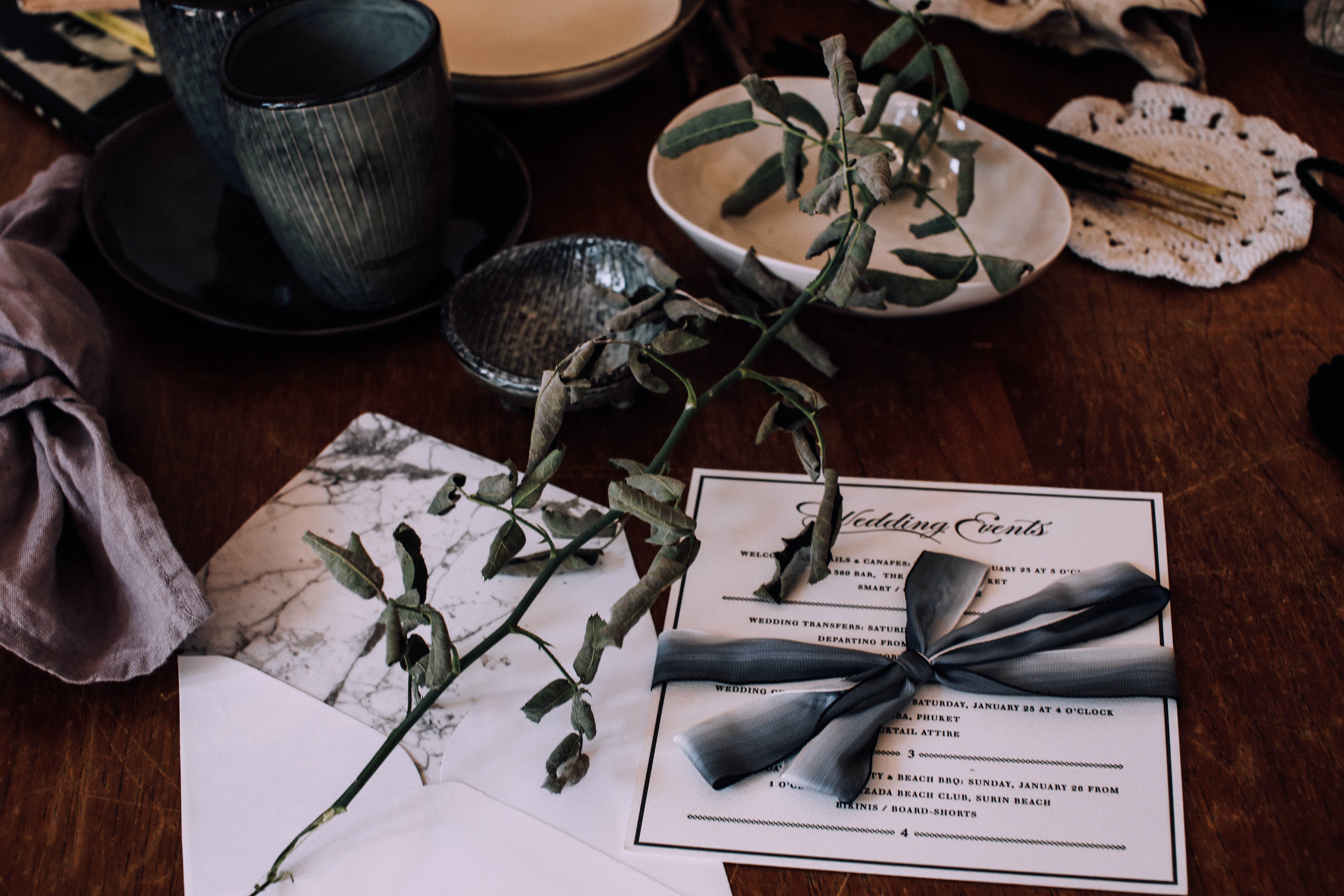 Free Wedding invitation on table with utensil and decorations Stock Photo