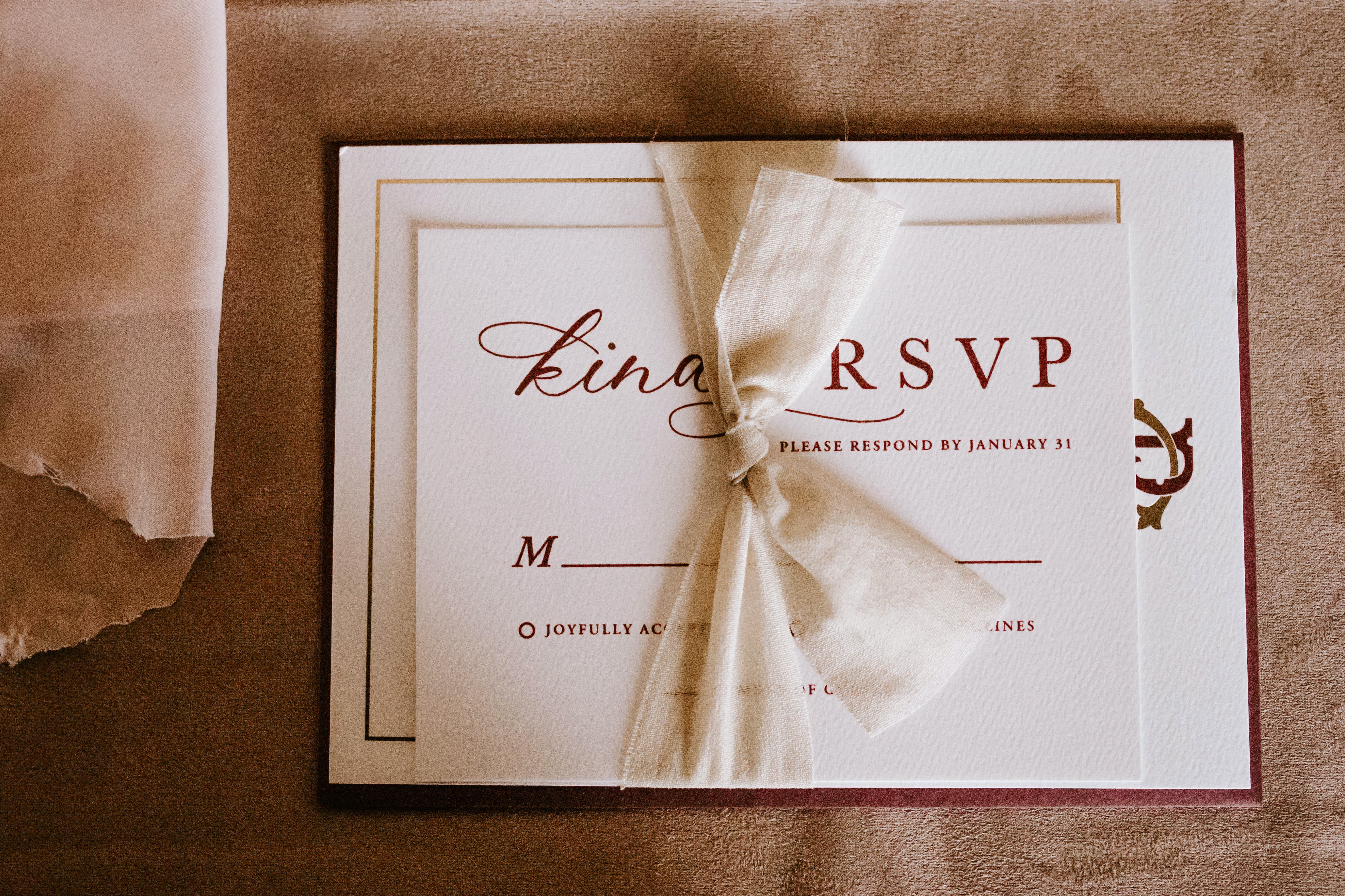 Free Invitation card with the inscription tied with ribbon Stock Photo