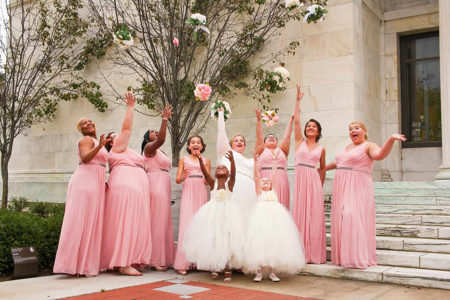 Free Women Wearing Dresses While Throwing Bouquets Stock Photo