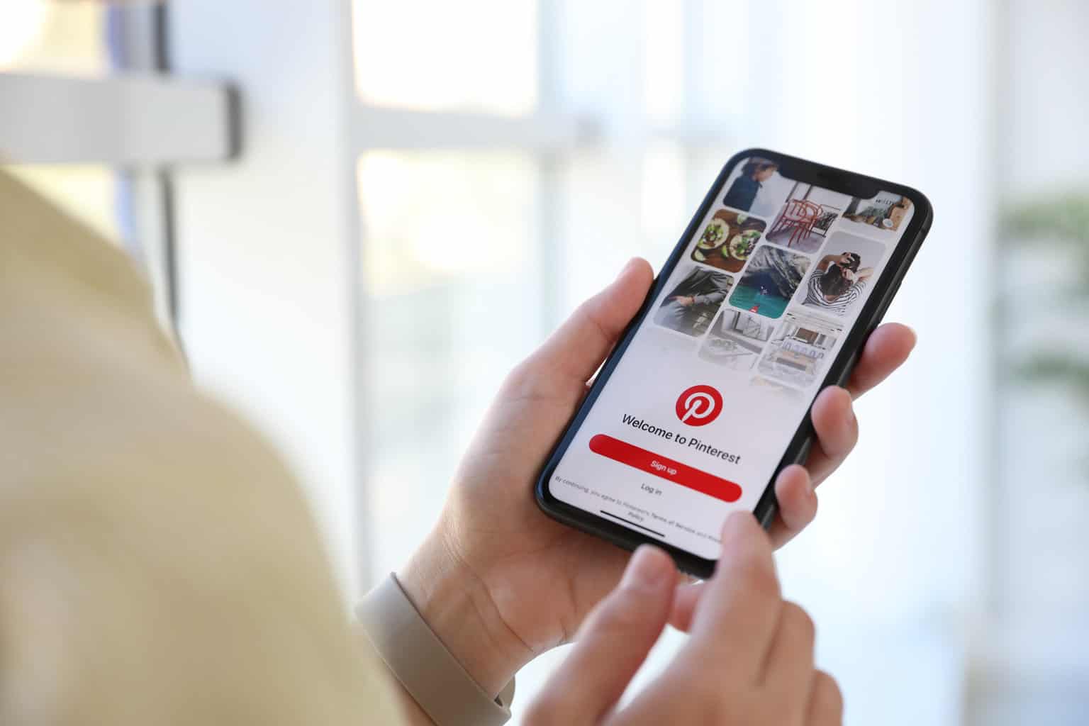 A person scrolling through Pinterest.
