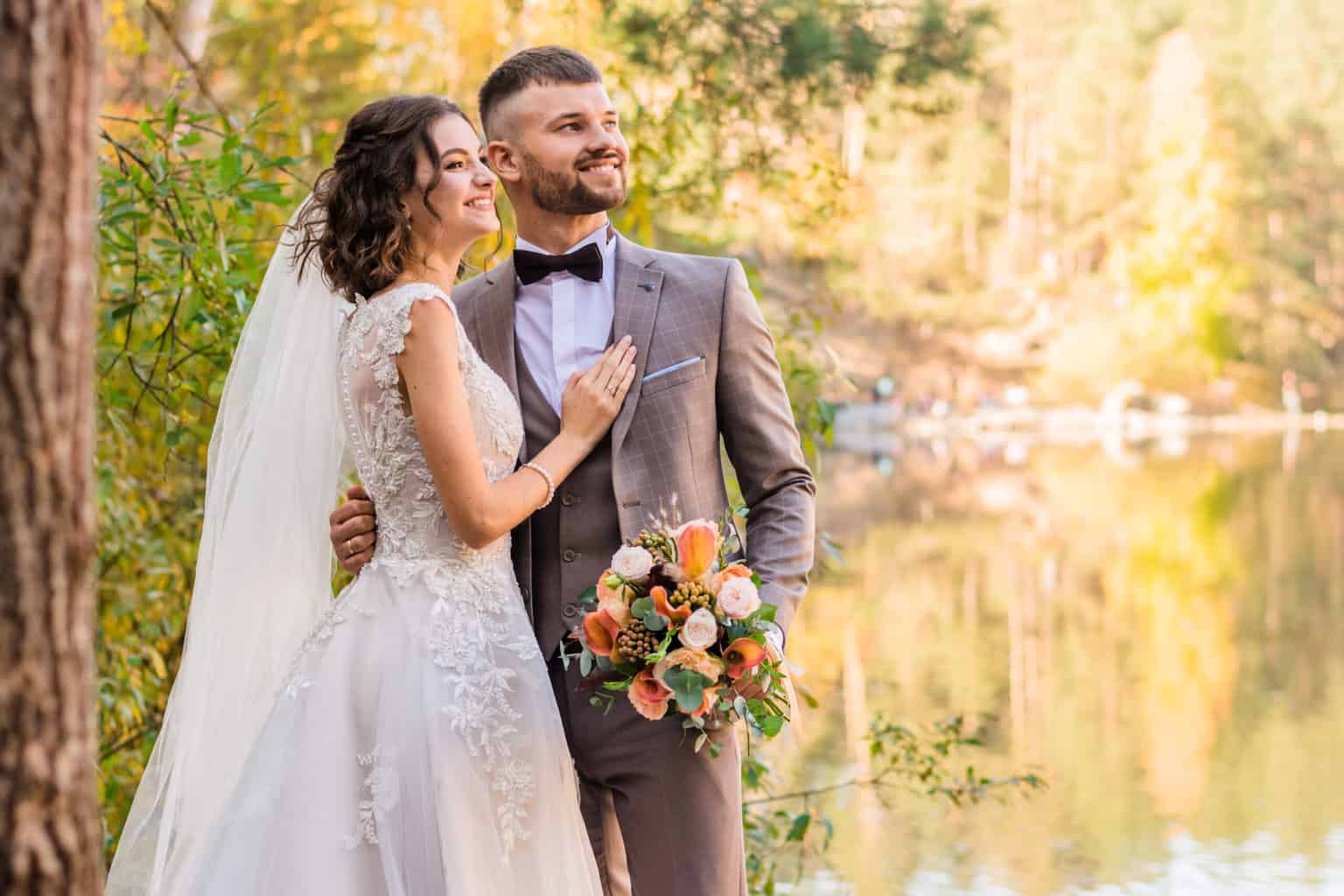 A wedding couplte posing for a photo.