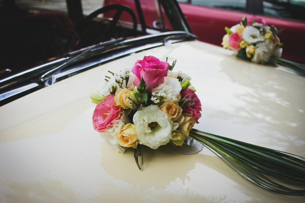 Pink Green and White Flower Bouquet on Beige Car 