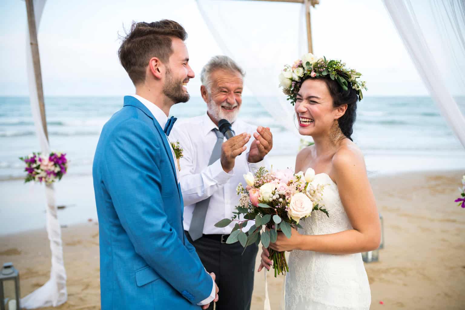 Couple having a laugh at their wedding