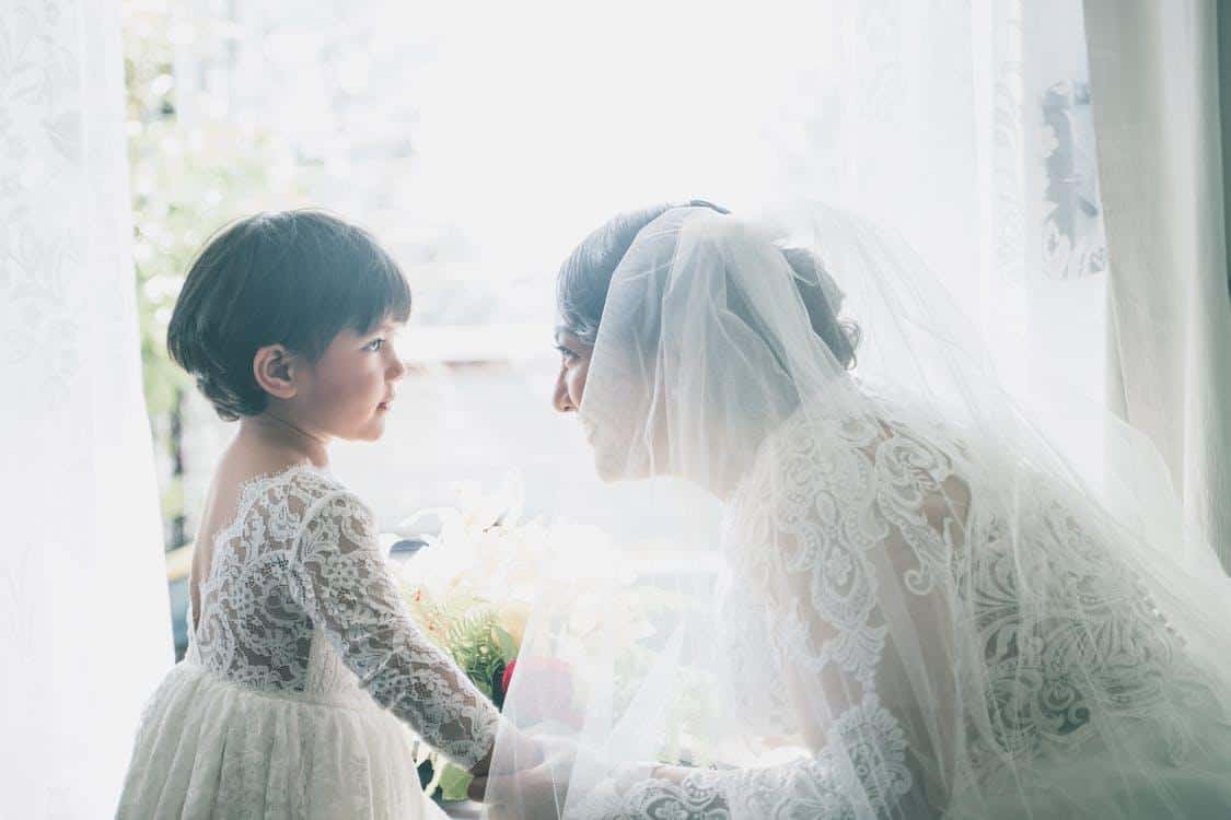 Free Ethnic bride and girl in dresses Stock Photo