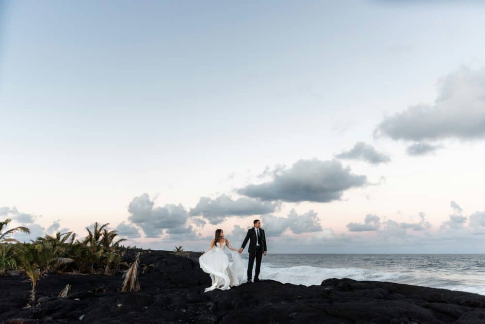 Choosing a Small Wedding Destination - What Makes a Venue “Small”? 6 A bride and groom standing on a rocky beach
