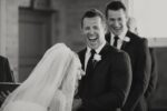 Couple laughing at their own wedding vows